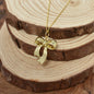 Gold Zinc Alloy Coquette Bow Necklace on a Yellow Gold Plated Sterling Silver Cable Chain. Bow Jewelry. Ribbon Jewelry. Coquette Jewelry.