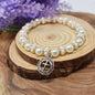 Holy Cross Glass Bead Bracelet. Daisy Spacers. Gold and Pearl Beaded Bracelet.